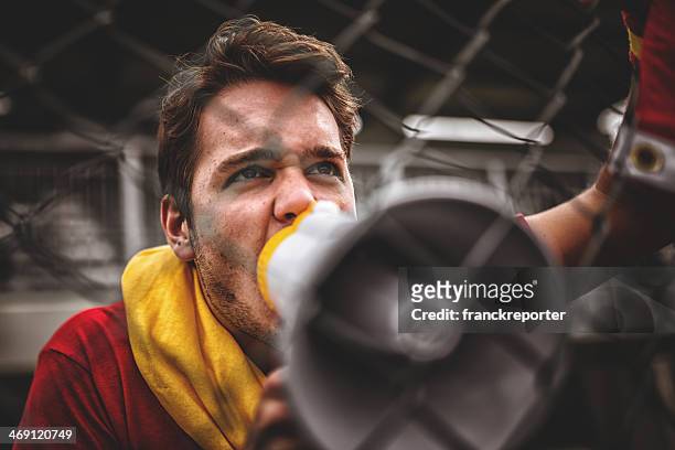 spanish soccer supporter screaming at the edge of field - hooligan stock pictures, royalty-free photos & images