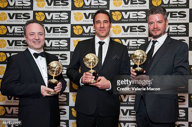 The winners for Outstanding Virtual Cinematography in a Live Action Feature Motion Picture Tim Webber, Richard McBride and Dale Newton pose at The...