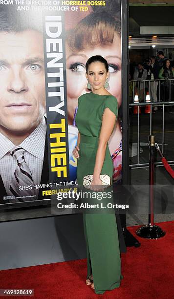 Actress Genesis Rodriguez arrives for the Premiere Of Universal Pictures' "Identity Thief" held at Mann Village Theater on February 4, 2013 in...