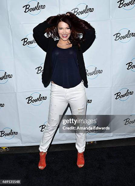 Recording artist and actress Emii arrives at the Bowlero Mar Vista celebrity grand opening at Bowlero on April 9, 2015 in Mar Vista, California.