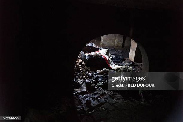 Dead bodies lay in a petrol tank in a former military camp used by ex seleka rebels, in Bangui, on February 13, 2014. The head of the UN's refugee...