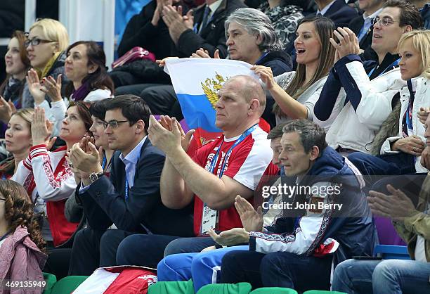 Olympians Alexander Popov, Alexander Karelin and abovee them Yelena Isinbayeva of Russia attend the Figure Skating Pairs Free Program on day 5 of the...