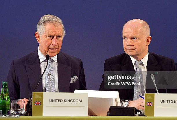 Foreign Secretary William Hague listen to a speech by Prince Charles, Prince of Wales at the Illegal Wildlife Trade Conference at Lancaster House on...