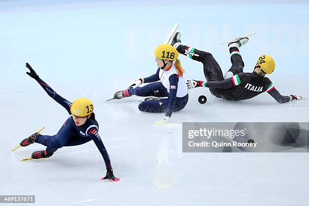 Elise Christie of Great Britain falls and collides with Seung-Hi Park of South Korea and Arianna Fontana of Italy as she competes in the Short Track...