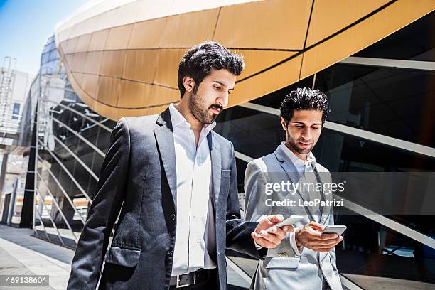 business men in travel - middle east clothing stock pictures, royalty-free photos & images