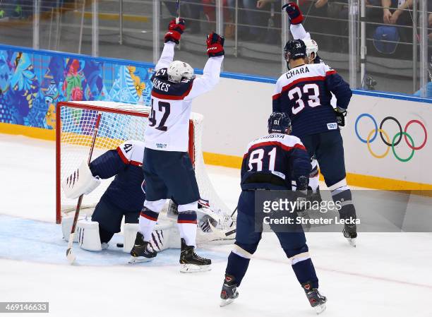 David Backes of United States scores a goal against Jaroslav Halak of Slovakia in the second period during the Men's Ice Hockey Preliminary Round...