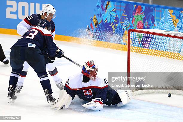 Jaroslav Halak of Slovakia lets in a goal by Paul Stastny of United States in the second period during the Men's Ice Hockey Preliminary Round Group A...