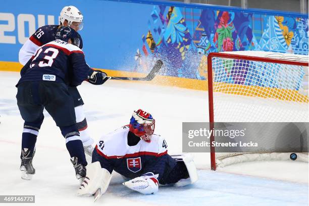 Jaroslav Halak of Slovakia lets in a goal by Paul Stastny of United States in the second period during the Men's Ice Hockey Preliminary Round Group A...