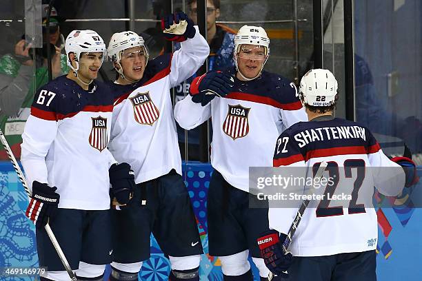 Paul Stastny of United States celebrates with team-mates after scoring a goal against Jaroslav Halak of Slovakia in the second period during the...