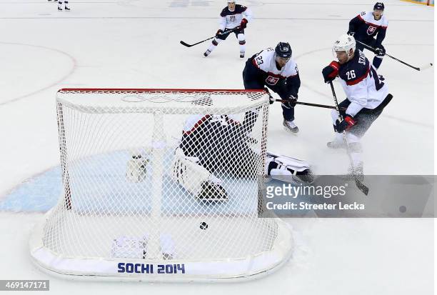 Paul Stastny of United States scores a goal against Jaroslav Halak of Slovakia in the second period during the Men's Ice Hockey Preliminary Round...