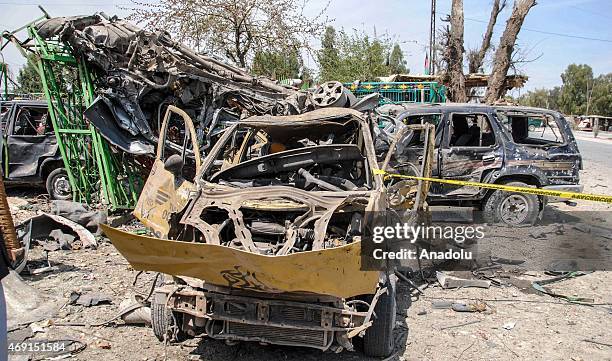 Damaged vehicles are seen at the site of a suicide bomb attack targeting a convoy of U.S. Forces near Nangarhar airport, which is used as a U.S....