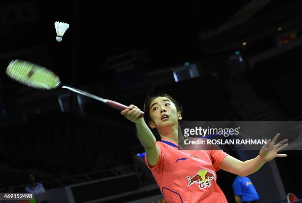 China's Wang Shixian plays against Japan's Akane Yamaguchi in their women's single quarter-finals of the Singapore Open on April 10, 2015. AFP PHOTO...