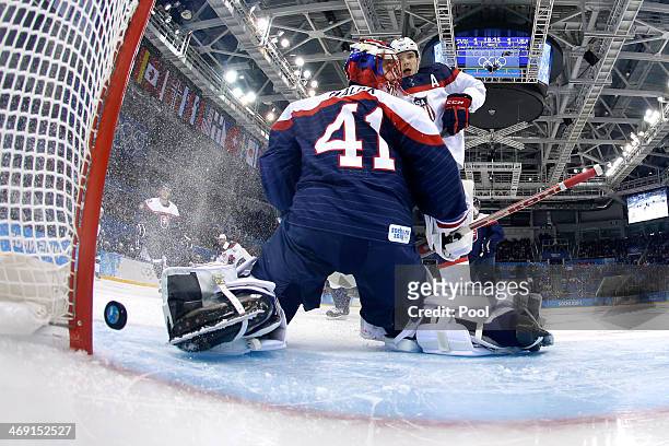 Phil Kessel of United States scores a goal against Jaroslav Halak of Slovakia in the second period during the Men's Ice Hockey Preliminary Round...