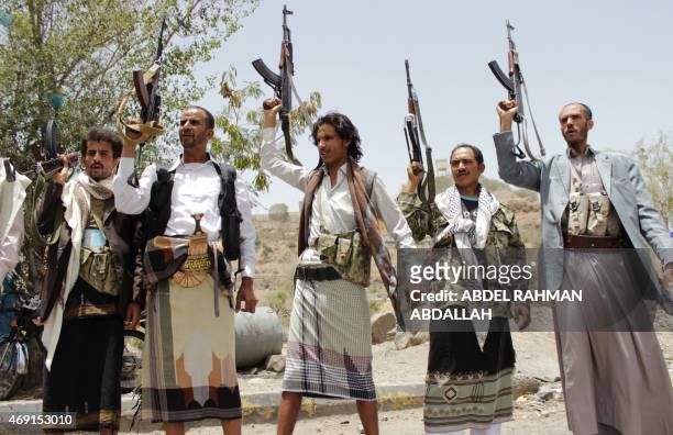 Supporters of the Shiite Huthi militia brandish their weapons in Yemen's second largest city of Taez, on April 10 during a protest against the...