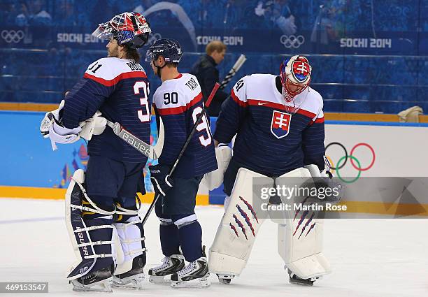 Peter Budaj of Slovakia, Tomas Tatar of Slovakia and Jaroslav Halak of Slovakia dejected after their 7-1 loss to the United States after the Men's...