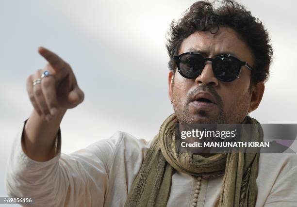 Indian Bollywood actor Irfan Khan speaks during a promotional event for a sustainable living project in Bangalore on April 10, 2015. AFP PHOTO /...