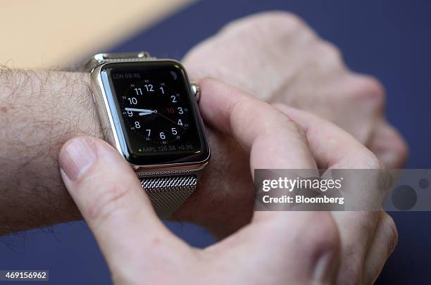 Customer tries the different functions of a new Apple Watch smartwatch during a preview event at Apple Inc.'s Covent Garden store in London, U.K., on...