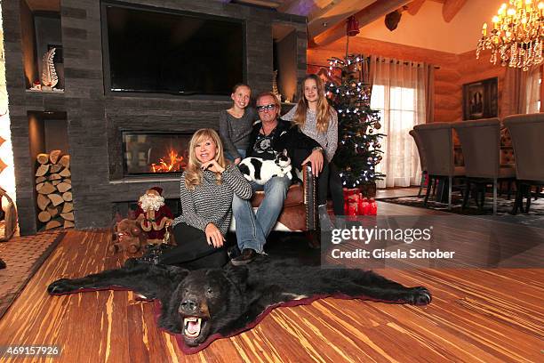 Carmen Geiss, Robert Geiss, daughter Davina Shakira and daughter Shania Tyra pose during a photo shooting in their house on December 13, 2014 in...