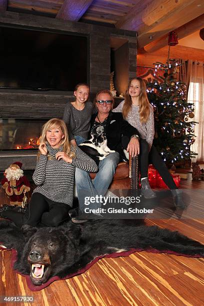 Carmen Geiss, Robert Geiss, daughter Davina Shakira and daughter Shania Tyra pose during a photo shooting in their house on December 13, 2014 in...