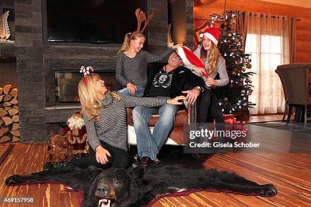 Carmen Geiss, Robert Geiss, daughter Davina Shakira and daughter Shania Tyra pose during a photo shooting in their house on December 13, 2014 in...