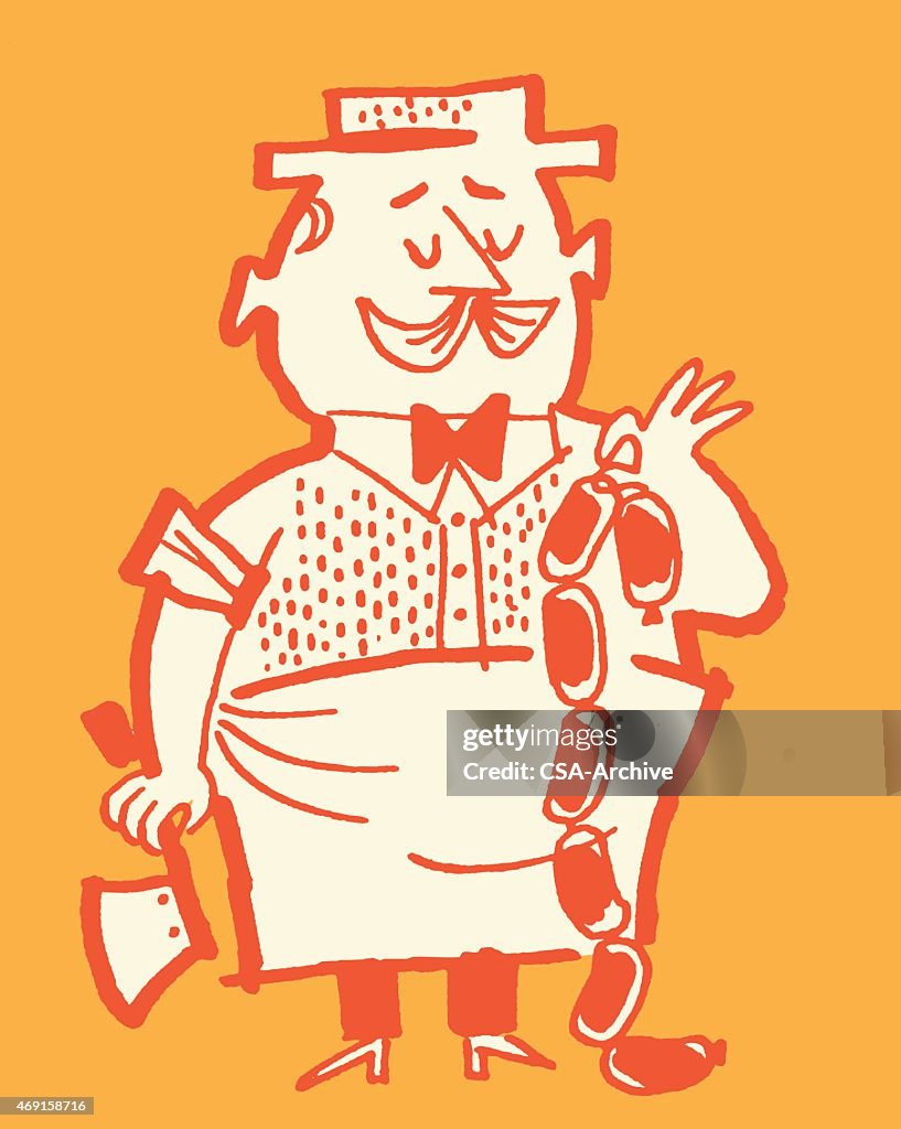 Butcher Holding Sausage Links