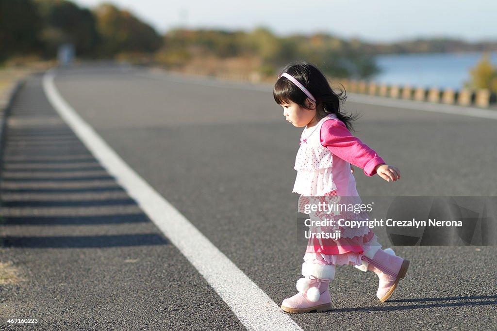 Toddler crossing the road