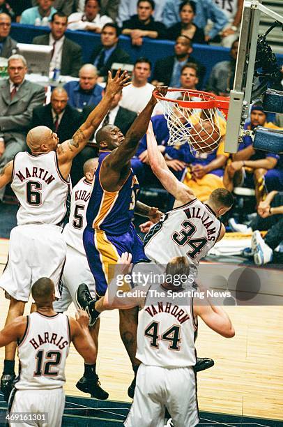 Shaquille O'Neal of the Los Angeles Lakers dunks during Game Four of the NBA Finals against the New Jersey Nets on June 12, 2002 at Continental...