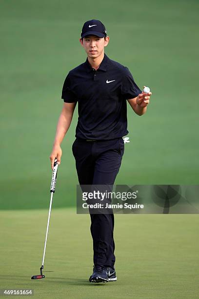 Seung-Yul Noh of Korea waves to the gallery on the second green during the second round of the 2015 Masters Tournament at Augusta National Golf Club...