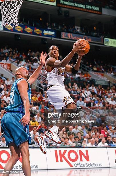 Allen Iverson of the Philadelphia 76ers takes the ball to the basket during the game against the Charlotte Hornets on April 8, 1998 at CoreStates...