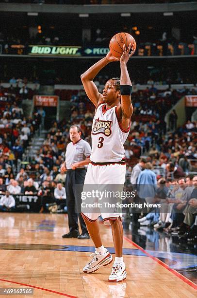 Allen Iverson of the Philadelphia 76ers looks to move the ball during the game against the Charlotte Hornets on April 8, 1998 at CoreStates Center in...