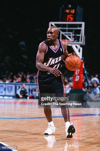 Jacque Vaughn of the Utah Jazz moves the ball during the game against the Charlotte Hornets on December 2, 2000 at Charlotte Coliseum in Charlotte,...