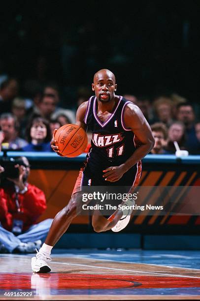 Jacque Vaughn of the Utah Jazz moves the ball during the game against the Charlotte Hornets on December 2, 2000 at Charlotte Coliseum in Charlotte,...