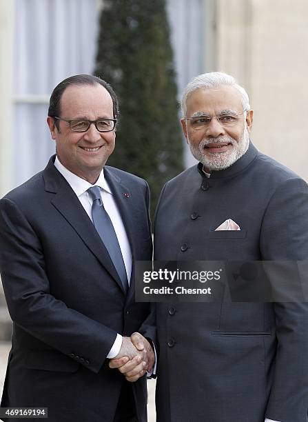 French President Francois Hollande welcomes Indian Prime Minister Narendra Modi prior a meeting at the Elysee Palace on April 10, 2015 in Paris,...