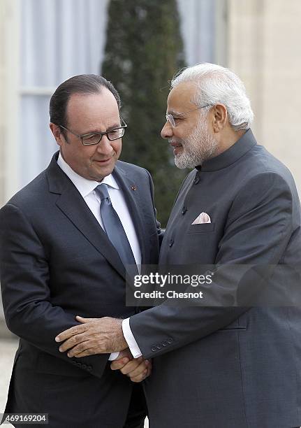 French President Francois Hollande welcomes Indian Prime Minister Narendra Modi prior a meeting at the Elysee Palace on April 10, 2015 in Paris,...