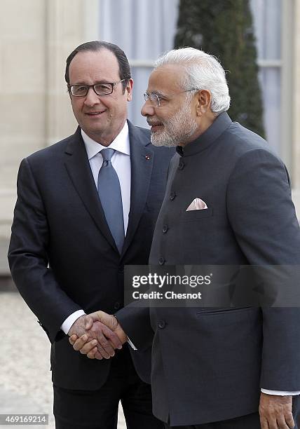 French President Francois Hollande welcomes Indian Prime Minister Narendra Modi prior a meeting at the Elysee Palace on April 10, 2015 in Paris,...