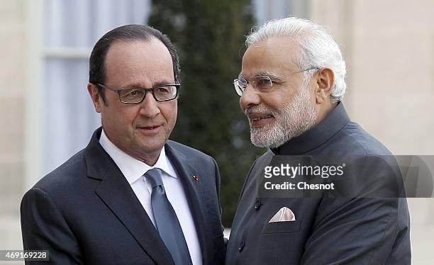 French President Francois Hollande welcomes Indian Prime Minister Narendra Modi prior a meeting at the Elysee Palace on April 10, 2015 in Paris,...