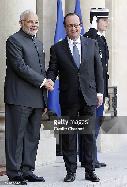 French President Francois Hollande welcomes Indian Prime Minister Narendra Modi prior a meeting at the Elysee Palace on April 10, 2015 in Paris,...