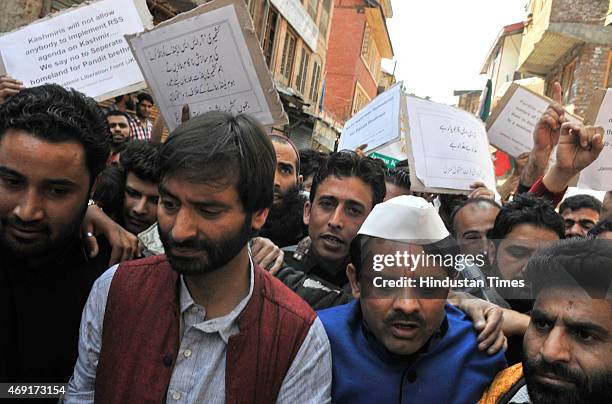 Kashmiri separatist leader and JKLF chairman Yasin Malik along with Kashmiri Pandits during a protest march against the government plan to build...