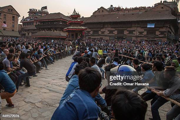 Nepalese devotees pull a wooden chariot on the first day of the Bisket Jatra festival on April 10, 2015 in Bhaktapur, Nepal. The Bisket Jatra...