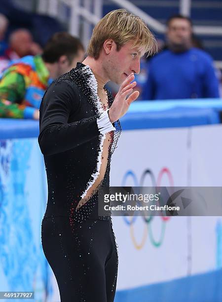 Evgeny Plyushchenko of Russia withdraws from the competition after warming up due to injury during the Men's Figure Skating Short Program on day 6 of...