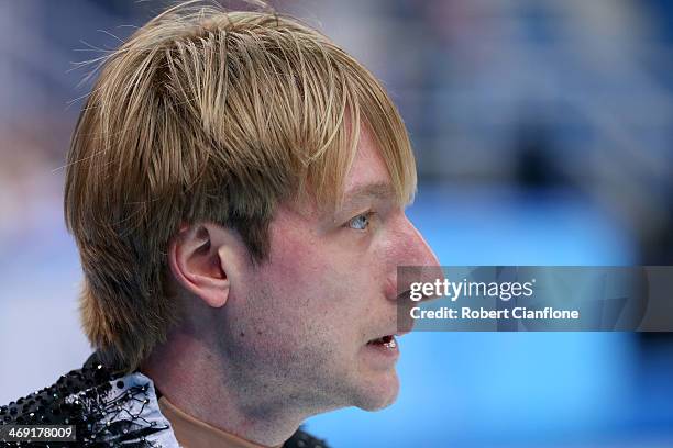 Evgeny Plyushchenko of Russia withdraws from the competition after warming up during the Men's Figure Skating Short Program on day 6 of the Sochi...