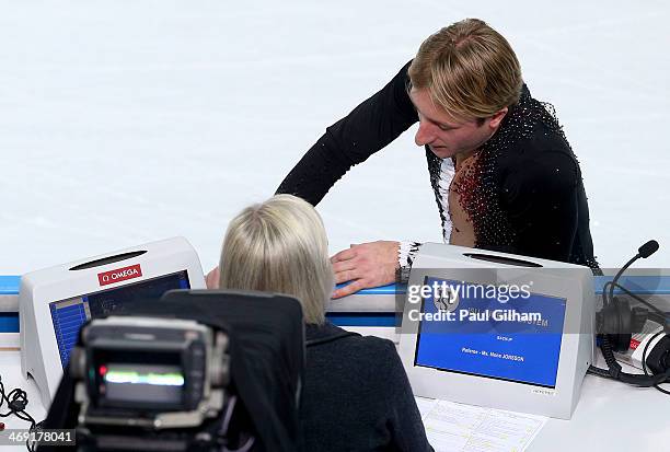 Evgeny Plyushchenko of Russia withdraws from the competition after warming up during the Men's Figure Skating Short Program on day 6 of the Sochi...