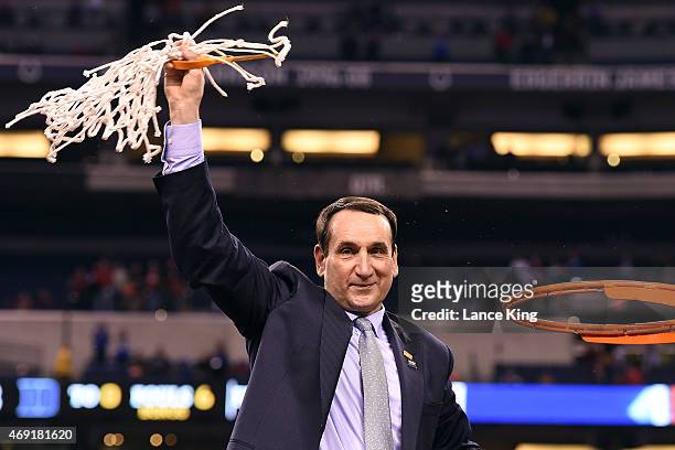 Head Coach Mike Krzyzewski of the Duke Blue Devils cuts down the net after defeating the Wisconsin Badgers during the NCAA Men's Final Four...