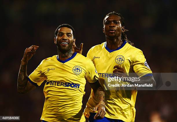 Jermaine Pennant of Wigan Athletic celebrates with Gaetan Bong as he scores their first and equalising goal from a free kick during the Sky Bet...