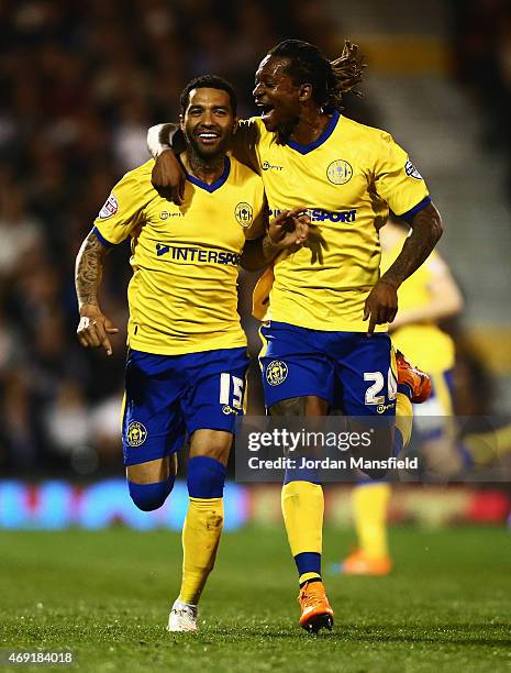 Jermaine Pennant of Wigan Athletic celebrates with Gaetan Bong as he scores their first and equalising goal from a free kick during the Sky Bet...