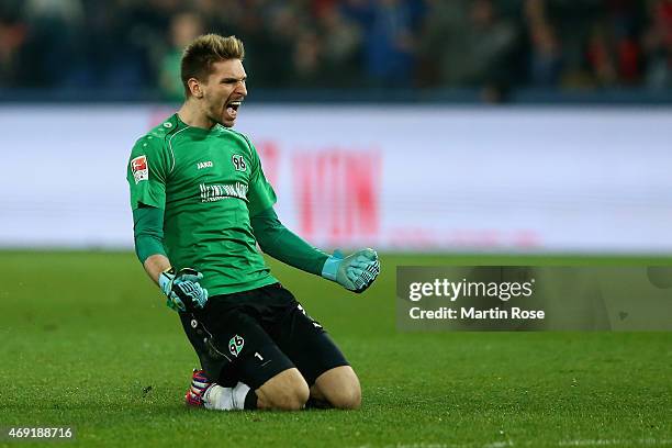 Ron-Robert Zieler of Hannover 96 celebrates as team mate Christian Schulz scores the opening goal during the Bundesliga match between Hannover 96 and...