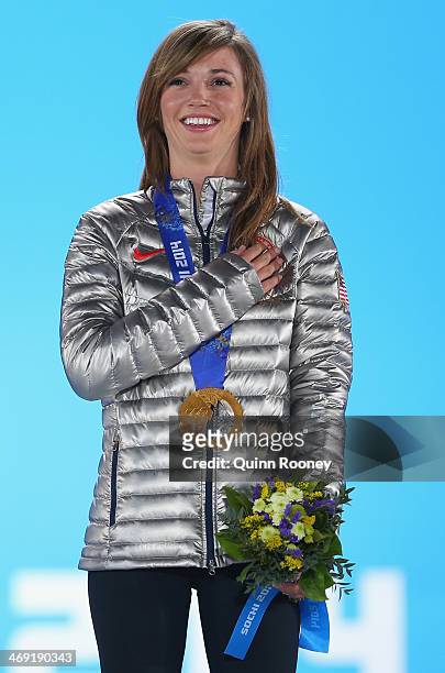 Gold medalist Kaitlyn Farrington of the United States celebrates during the medal ceremony for the Snowboard Ladies' Halfpipe on day six of the Sochi...