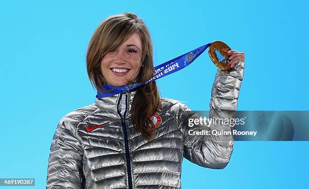 Gold medalist Kaitlyn Farrington of the United States celebrates during the medal ceremony for the Snowboard Ladies' Halfpipe on day six of the Sochi...