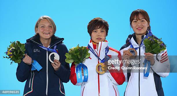 Silver medalist Arianna Fontana of Italy, gold medalist Jianrou Li of China and bronze medalist Seung-Hi Park of Korea celebrate during the medal...