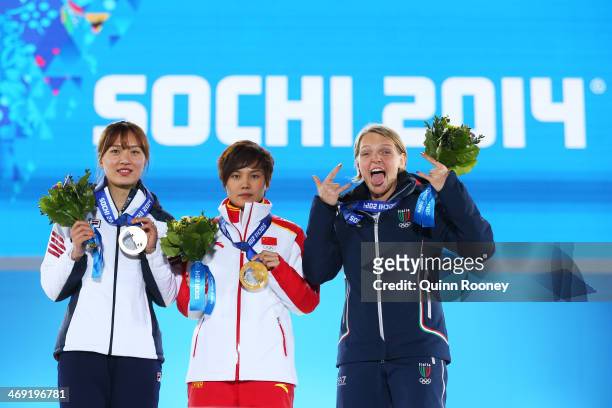 Bronze medalist Seung-Hi Park of Korea, gold medalist Jianrou Li of China and silver medalist Arianna Fontana of Italy celebrate during the medal...